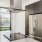 a kitchen with a stainless steel refrigerator