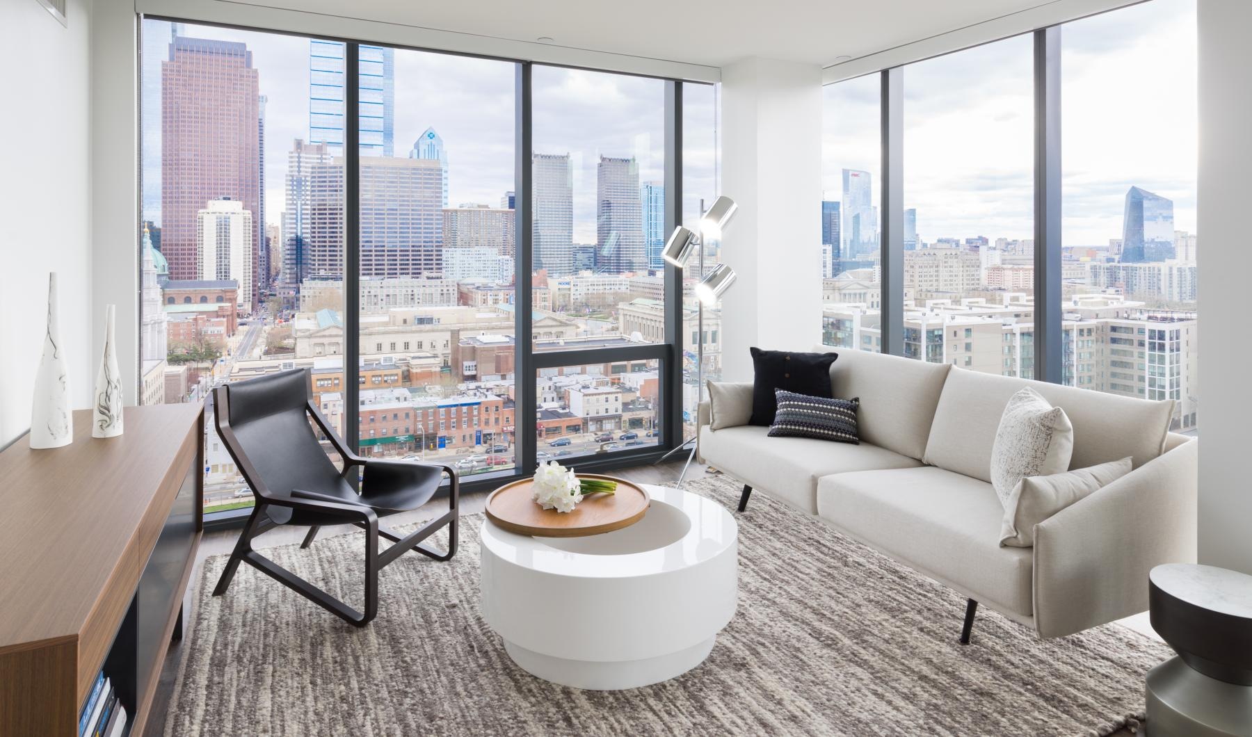 Modern living room with city view at North x Northwest Fairmount Philadelphia apartments